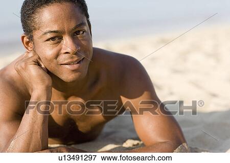 Man on a beach View Large Photo Image Stock Photo - Man on a beach. Fotosearch