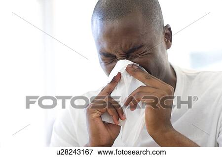 Man sneezing View Large Photo Image Stock Photo - Man sneezing. Fotosearch