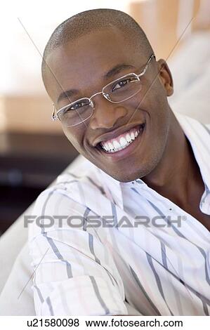 Stock Photo - Man wearing glasses. Fotosearch