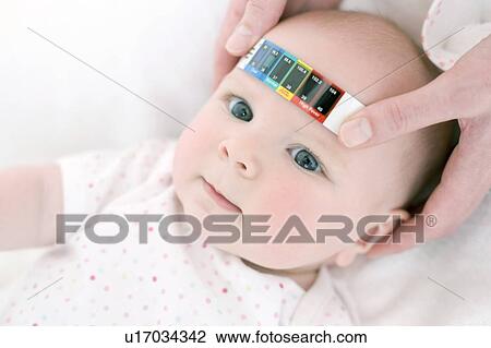 Measuring a baby's temperature View Large Photo Image Stock Image - Measuring a baby's temperature. Fotosearch