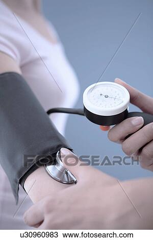 Measuring blood pressure View Large Photo Image Stock Image - Measuring blood pressure. Fotosearch