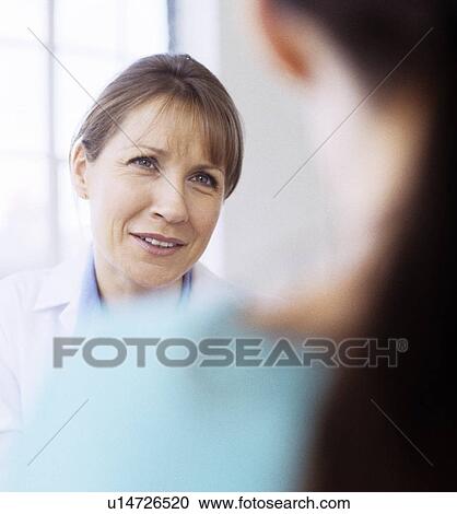 Stock Image - Medical consultation. Fotosearch