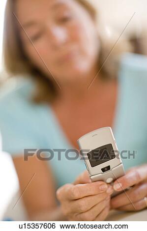 Stock Photograph - Mobile phone texting. Fotosearch