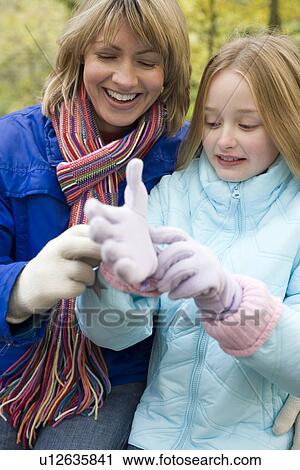 Mother and daughter outdoors in winter View Large Photo Image Stock Image - Mother and daughter outdoors in winter. Fotosearch