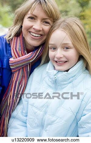 Mother and daughter outdoors in winter View Large Photo Image Stock Photo - Mother and daughter outdoors in winter. Fotosearch