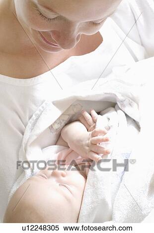Stock Photography - Mother and newborn baby. Fotosearch