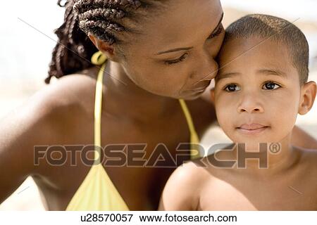 Stock Photo - Mother and son cuddling. Fotosearch