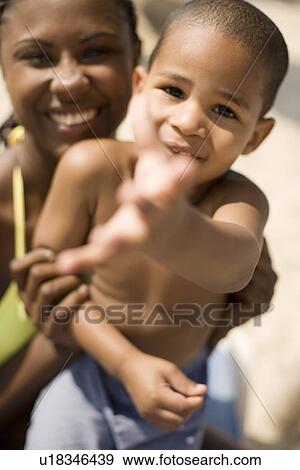 Mother and son playing View Large Photo Image Stock Photo - Mother and son playing. Fotosearch