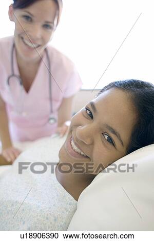 Stock Image - Nurse and patient. Fotosearch