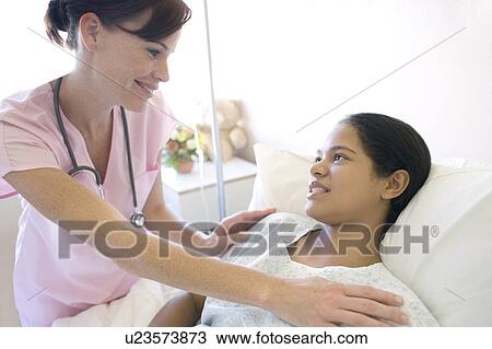 Stock Image - Nurse and patient. Fotosearch