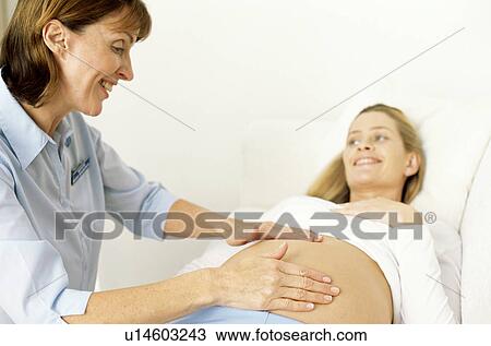 Stock Image - Obstetric examination. Fotosearch