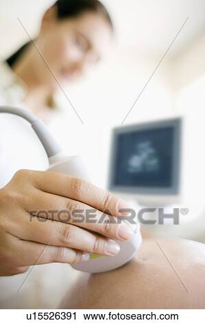 Stock Image - Obstetric ultrasound. Fotosearch