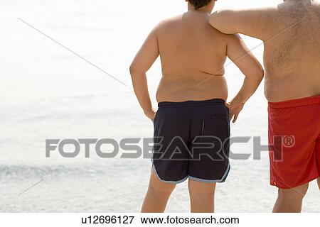 Overweight boy and man View Large Photo Image Stock Photo - Overweight boy and man. Fotosearch