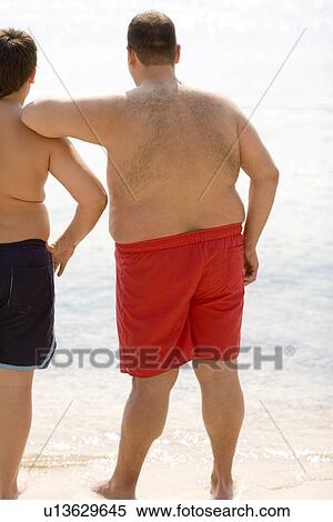 Stock Photography - Overweight man and boy. Fotosearch