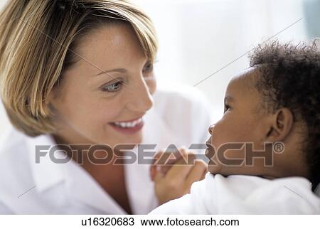 Stock Image - Paediatric examination. Fotosearch