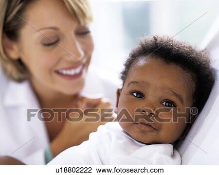 Stock Image - Paediatric examination. Fotosearch