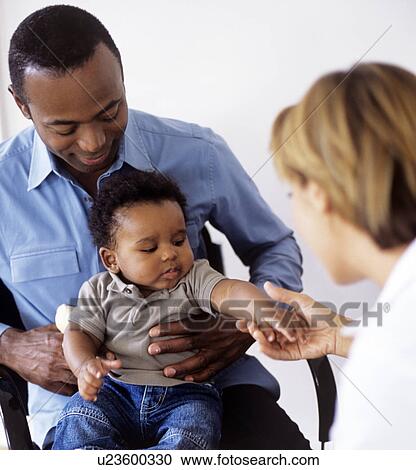 Stock Image - Paediatric examination. Fotosearch