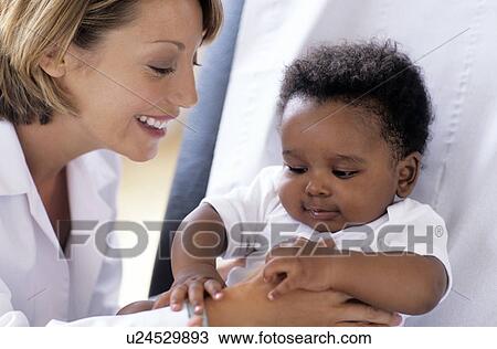 Stock Image - Paediatric examination. Fotosearch