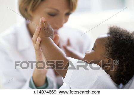 Stock Photo - Paediatric examination. Fotosearch
