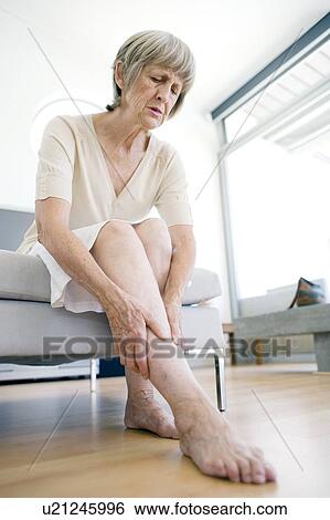 Painful leg View Large Photo Image Stock Photograph - Painful leg. Fotosearch