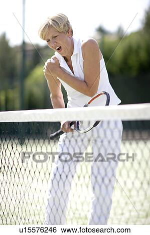 Stock Photograph - Painful shoulder injury. Fotosearch