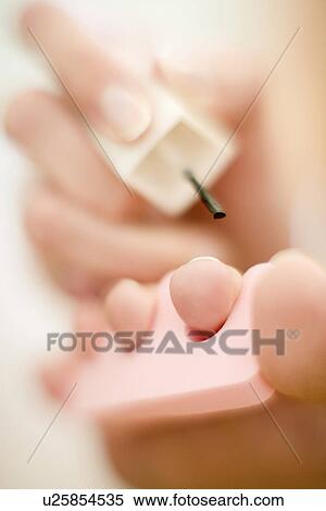 Painting nails View Large Photo Image Stock Photography - Painting nails. Fotosearch