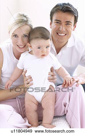 Stock Photo - Parents and baby boy. Fotosearch