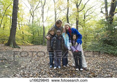Stock Photography - Parents and children in a wood. Fotosearch
