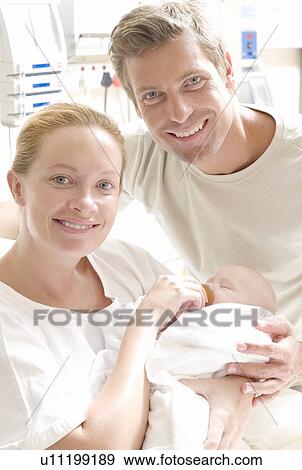 Parents and newborn baby View Large Photo Image Stock Photo - Parents and newborn baby. Fotosearch