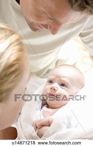 Stock Photo - Parents and newborn baby. Fotosearch