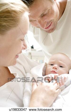 Parents and newborn baby View Large Photo Image Stock Photo - Parents and newborn baby. Fotosearch