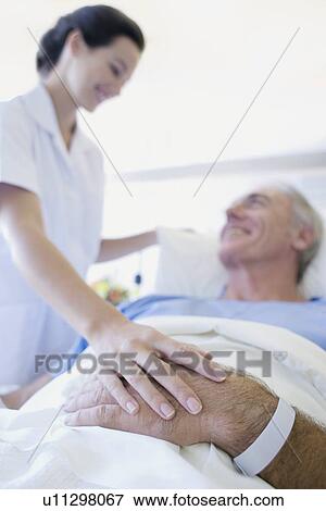 Stock Photo - Patient care. Fotosearch