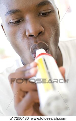 Stock Image - Peak flow meter use. Fotosearch