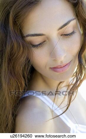 Stock Image - Pensive woman. Fotosearch