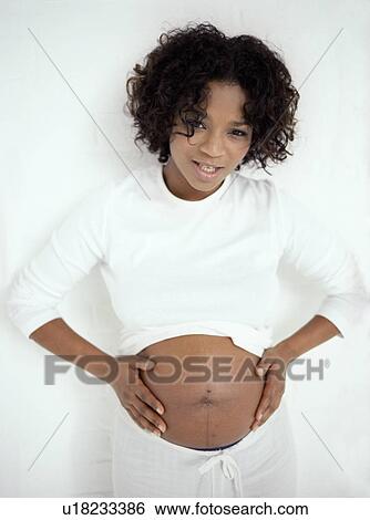 Stock Photograph - Pregnancy pains. Fotosearch