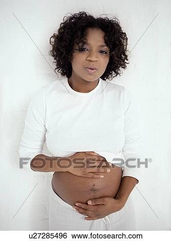 Stock Photograph - Pregnancy pains. Fotosearch