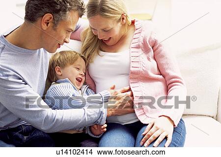 Pregnant woman and family View Large Photo Image Picture - Pregnant woman and family. Fotosearch