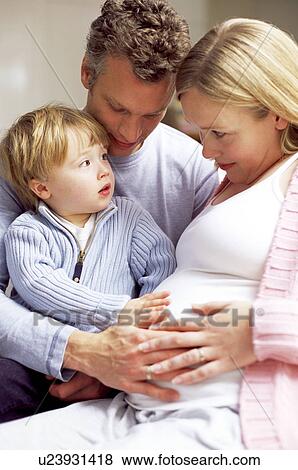 Stock Photo - Pregnant woman and family. Fotosearch