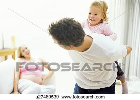 Pregnant woman and family View Large Photo Image Stock Photo - Pregnant woman and family. Fotosearch