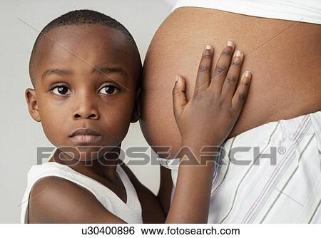 Pregnant woman and son View Large Photo Image Stock Photograph - Pregnant woman and son. Fotosearch