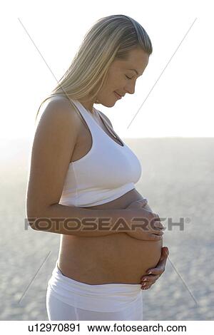 Stock Image - Pregnant woman. Fotosearch