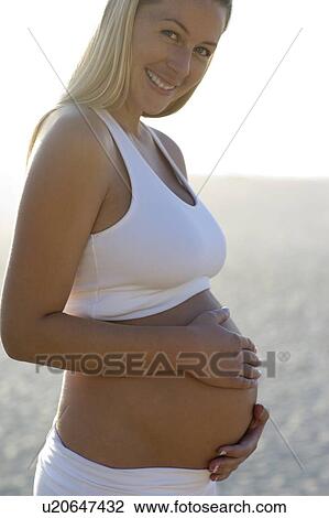 Stock Image - Pregnant woman. Fotosearch