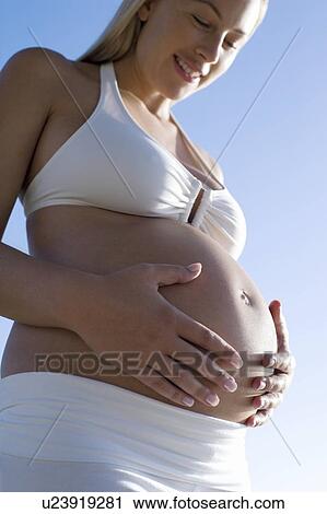 Stock Image - Pregnant woman. Fotosearch