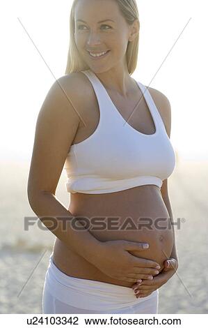 Stock Image - Pregnant woman. Fotosearch