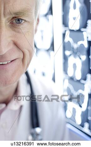 Radiologist and CT scans View Large Photo Image Stock Image - Radiologist and CT scans. Fotosearch
