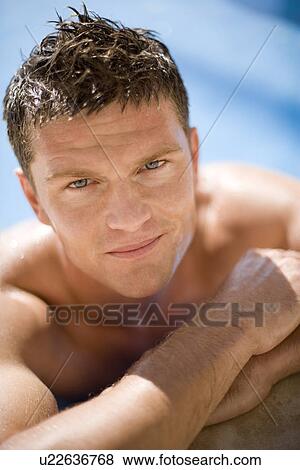 Stock Photo - Relaxed man on holiday. Fotosearch