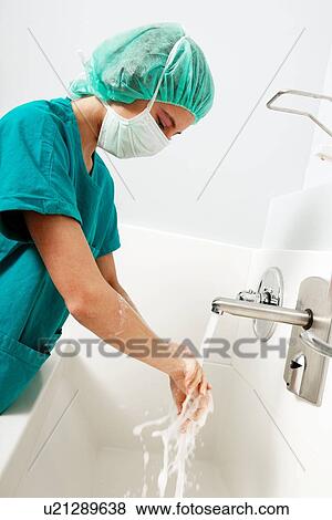 Stock Photo - Scrubbing up before surgery. Fotosearch