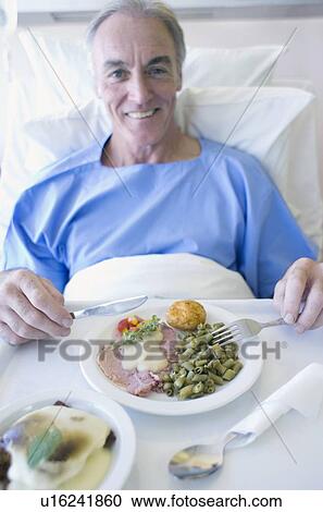 Senior patient eating a hospital meal View Large Photo Image Stock Image - Senior patient eating a hospital meal. Fotosearch