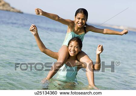 Sisters on holiday View Large Photo Image Stock Image - Sisters on holiday. Fotosearch