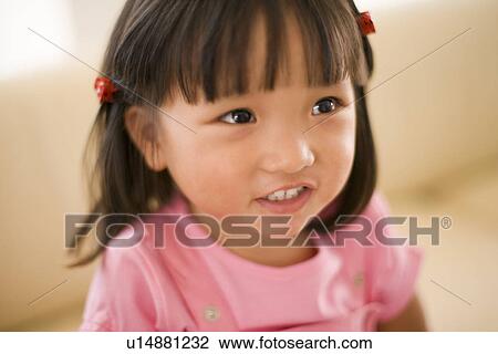 Stock Image - Smiling girl. Fotosearch
